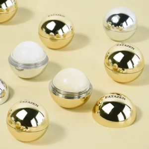 FATAZEN Golden Round Lip Balm in closed and open compact views