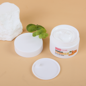 FATAZEN Turmeric Neck Care Cream open jar on a warm surface