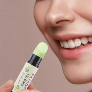 FATAZEN Honey Avocado Lip Balm held near smiling lips