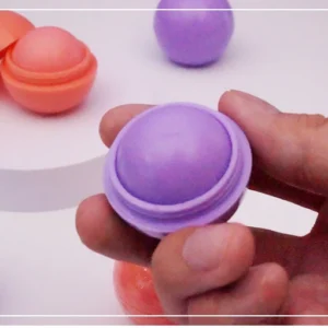FATAZEN Soft Glide Round Lip Balm held open in hand