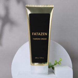 FATAZEN Tanning Cream 200 g gold tube on a gray studio background