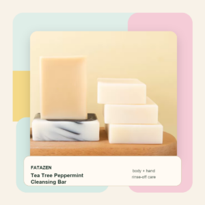 FATAZEN Tea Tree Peppermint Cleansing Bar on a tray with soap bars